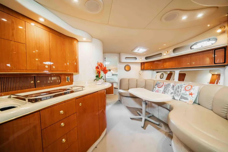  Yacht Photos Pics Luxurious interior of a 1998 Sea Ray Sundancer 400 yacht with elegant wood cabinetry.