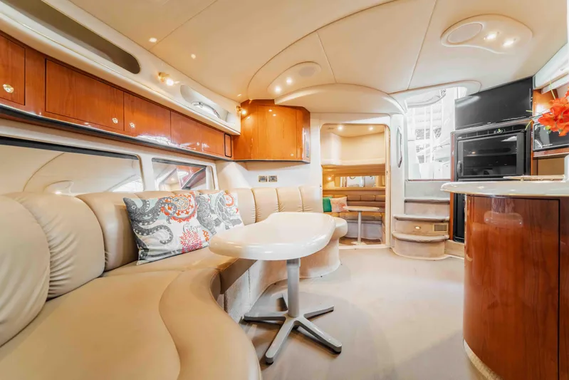 Yacht Photos Pics Luxurious interior of 1998 Sea Ray Sundancer 400 yacht with elegant seating and modern amenities.