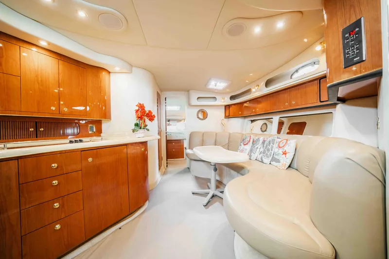  Yacht Photos Pics Luxurious interior of a 1998 Sea Ray Sundancer 400 yacht with elegant wood cabinetry.