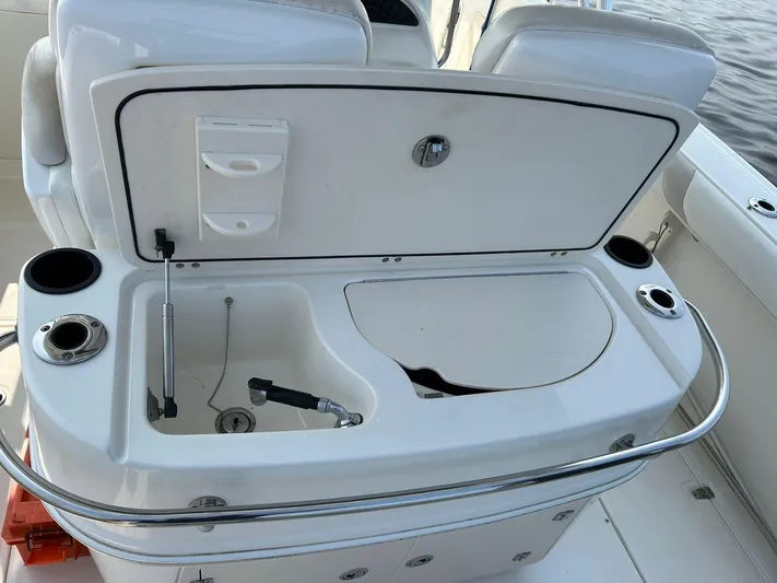 2009 Bw 320 Or Cc Yacht Photos Pics 2009 Boston Whaler 320 Outrage Cuddy Cabin, open storage compartment with cup holders.