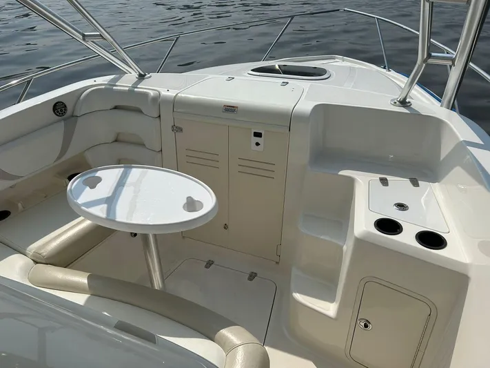 2009 Bw 320 Or Cc Yacht Photos Pics 2009 Boston Whaler 320 Outrage Cuddy Cabin interior with seating and table.