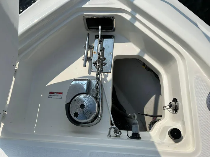 2009 Bw 320 Or Cc Yacht Photos Pics Anchor compartment of 2009 Boston Whaler 320 Outrage Cuddy Cabin boat.