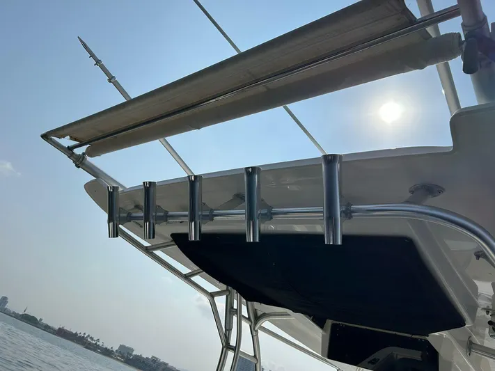 2009 Bw 320 Or Cc Yacht Photos Pics Boston Whaler 320 Outrage Cuddy Cabin 2009, boat canopy and rod holders under sunny sky.