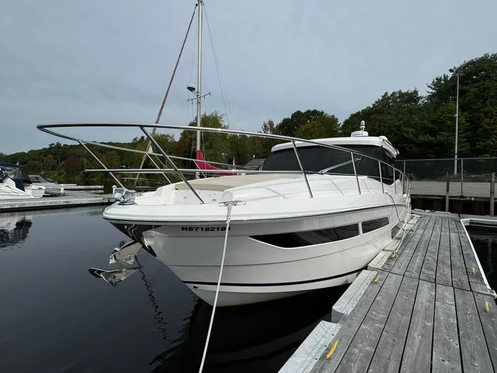 No Regrets Yacht Photos Pics 2020 Regal 38 Grande Coupe docked at a marina, showcasing sleek design and modern features.