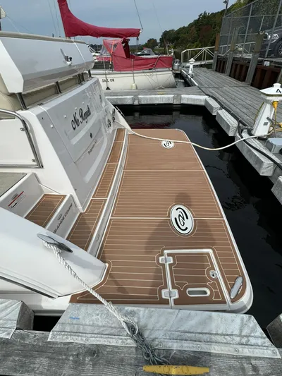 No Regrets Yacht Photos Pics 2020 Regal 38 Grande Coupe yacht docked with teak deck and sleek design.