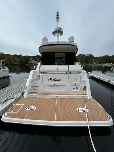 No Regrets Yacht Photos Pics 2020 Regal 38 Grande Coupe yacht docked at marina, rear view.