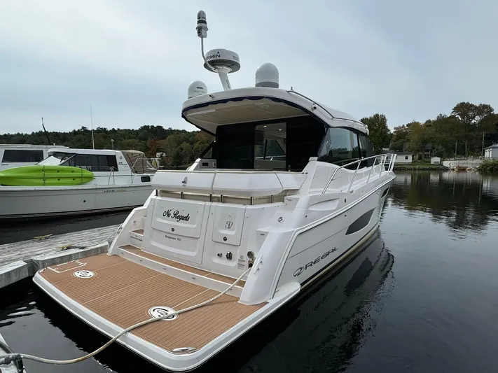 No Regrets Yacht Photos Pics 2020 Regal 38 Grande Coupe yacht docked on calm water.