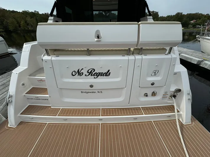 No Regrets Yacht Photos Pics 2020 Regal 38 Grande Coupe yacht stern with "No Regrets" name, docked in Bridgewater, N.S.