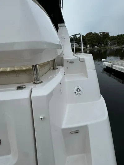 No Regrets Yacht Photos Pics 2020 Regal 38 Grande Coupe yacht stern view at a dock.