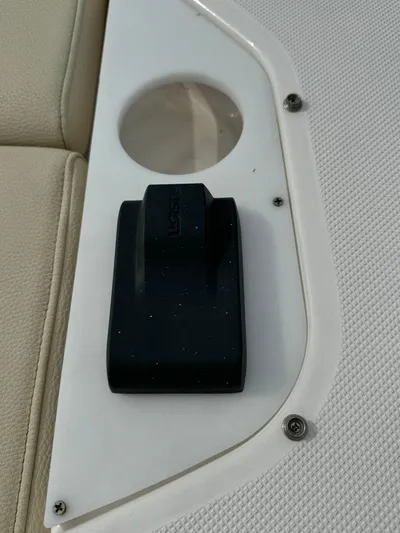 No Regrets Yacht Photos Pics 2020 Regal 38 Grande Coupe interior detail with cup holder and black latch.