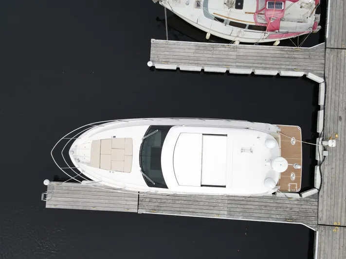 No Regrets Yacht Photos Pics Aerial view of 2020 Regal 38 Grande Coupe docked at a marina.