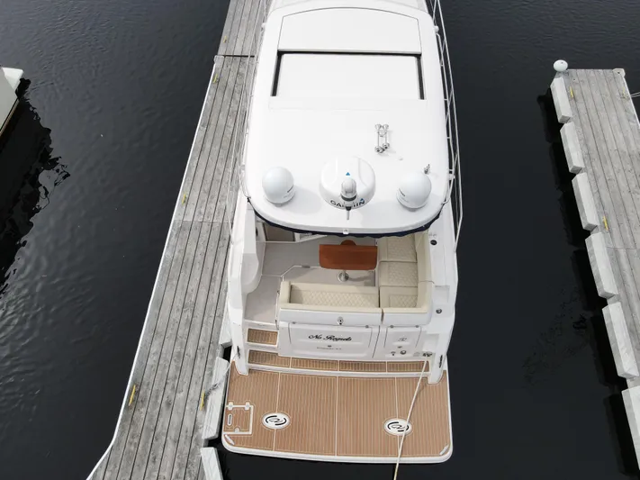 No Regrets Yacht Photos Pics 2020 Regal 38 Grande Coupe yacht docked at marina, aerial view.