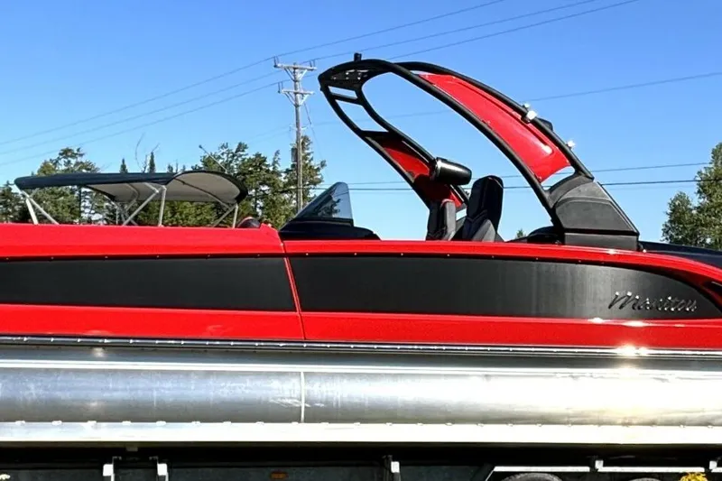  Yacht Photos Pics Red and black 2022 Manitou XT 27 SRW pontoon boat with sleek design.