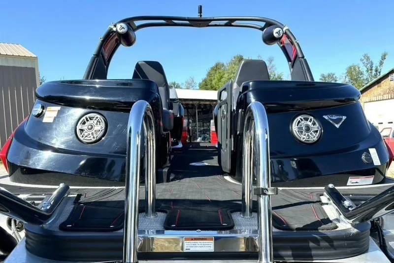  Yacht Photos Pics 2022 Manitou XT 27 SRW boat with sleek black design and chrome accents.