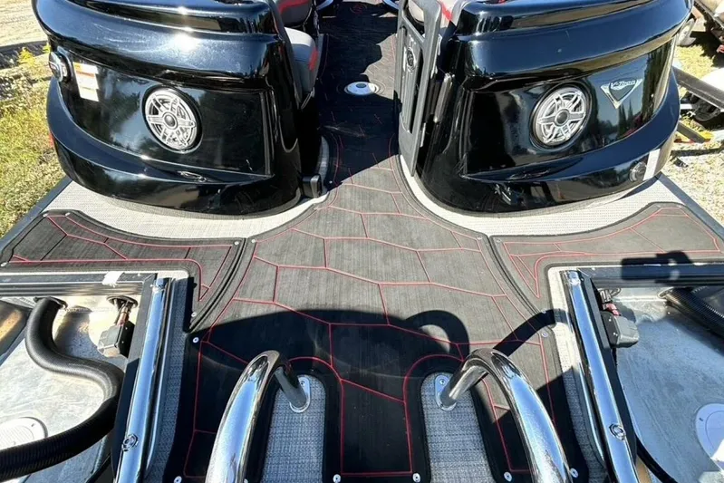  Yacht Photos Pics 2022 Manitou XT 27 SRW boat interior with sleek black design and modern features.