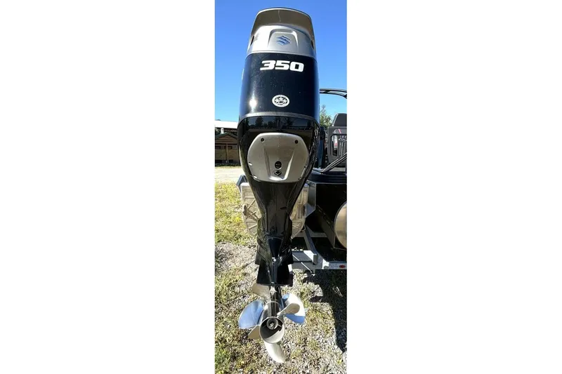  Yacht Photos Pics 2022 Manitou XT 27 SRW boat engine, 350 horsepower, displayed outdoors.