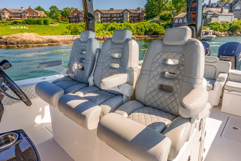  Yacht Photos Pics Luxurious seating on the 2024 HCB 39 Speciale boat with scenic waterfront view.