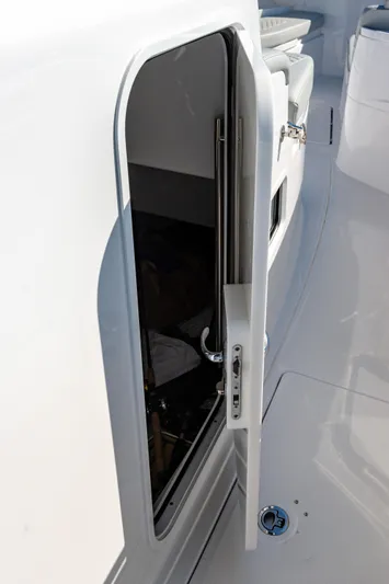  Yacht Photos Pics 2024 HCB 39 Speciale boat cabin door, open, showing sleek white design.