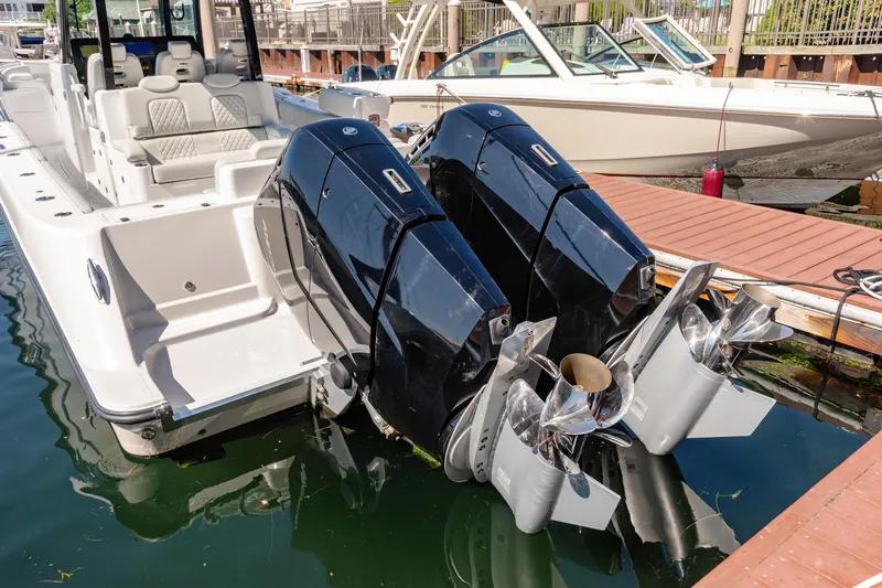  Yacht Photos Pics 2024 HCB 39 Speciale boat with dual outboard engines docked.