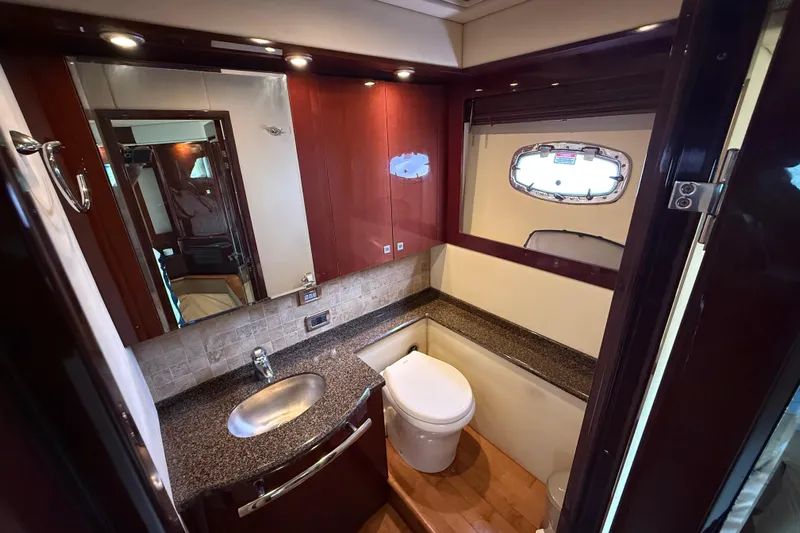 Positive Vibes Yacht Photos Pics Luxurious bathroom interior of 2008 Sea Ray 550 Sundancer yacht with modern fixtures.