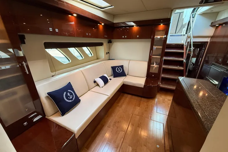 Positive Vibes Yacht Photos Pics Luxurious interior of 2008 Sea Ray 550 Sundancer yacht with elegant seating and wooden finishes.