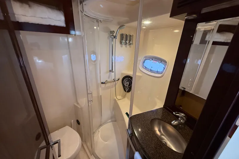 Positive Vibes Yacht Photos Pics Luxurious bathroom in 2008 Sea Ray 550 Sundancer yacht with shower and sink.