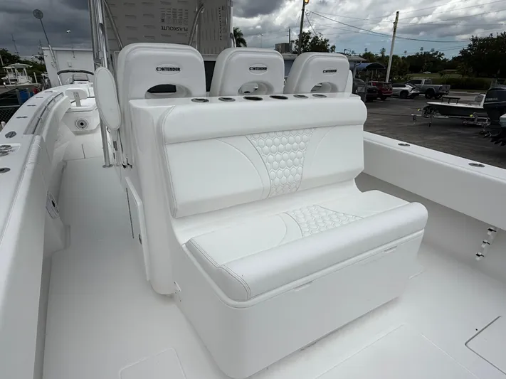  Yacht Photos Pics 2026 Contender 39 ST boat interior with white seating and cup holders.