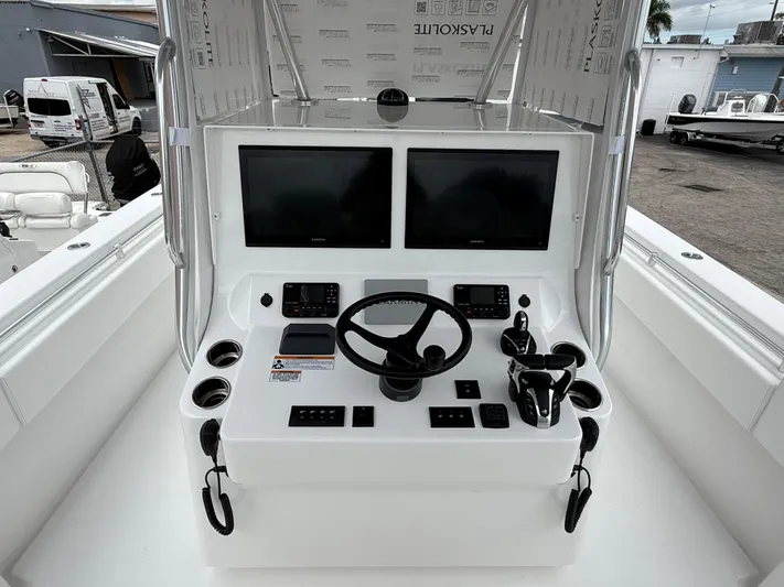  Yacht Photos Pics 2026 Contender 39 ST boat console with dual screens and steering wheel.