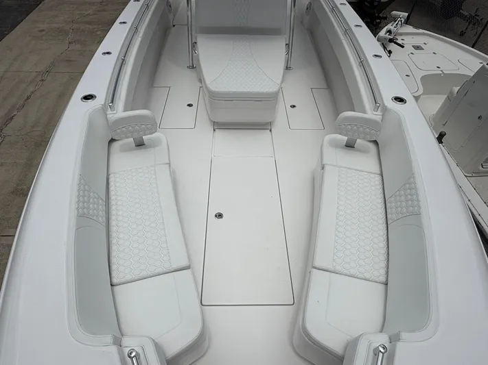  Yacht Photos Pics 2026 Contender 39 ST boat interior with white cushioned seating and sleek design.