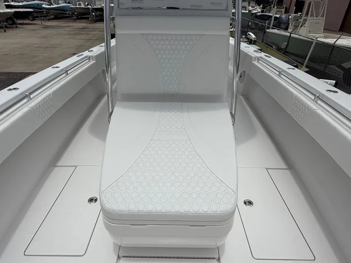  Yacht Photos Pics 2026 Contender 39 ST boat interior with white cushioned seating and sleek design.