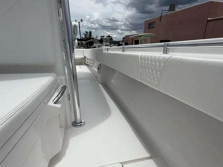  Yacht Photos Pics 2026 Contender 39 ST boat interior with sleek white seating and modern design.