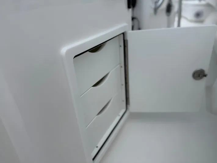  Yacht Photos Pics Open storage compartment with drawers on a 2026 Contender 39 ST boat.