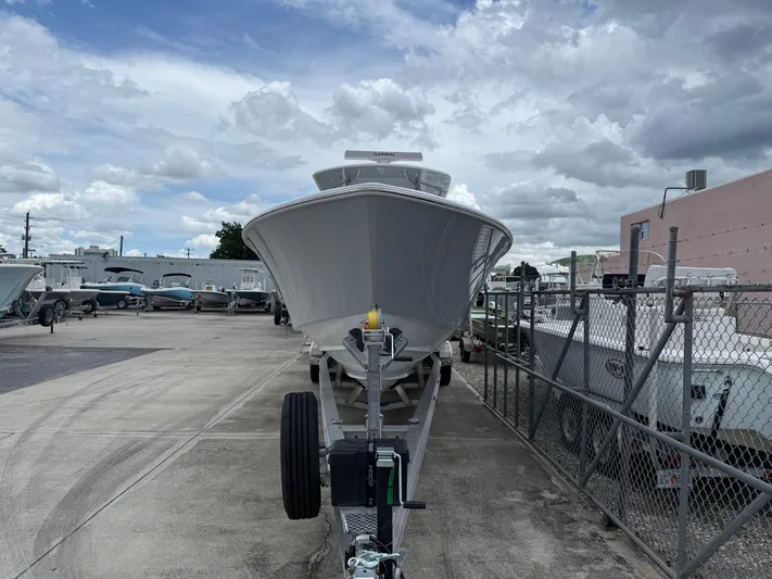  Yacht Photos Pics 2026 Contender 39 ST boat on trailer in a marina under cloudy sky.