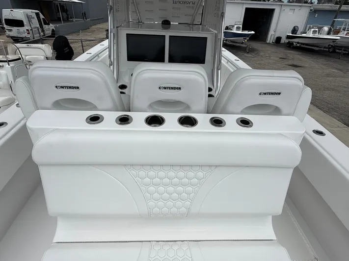  Yacht Photos Pics 2026 Contender 39 ST boat interior with white seating and cup holders.