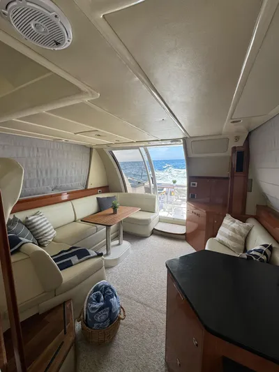  Yacht Photos Pics Interior of 2009 Sealine F42/5 yacht with elegant seating and ocean view.