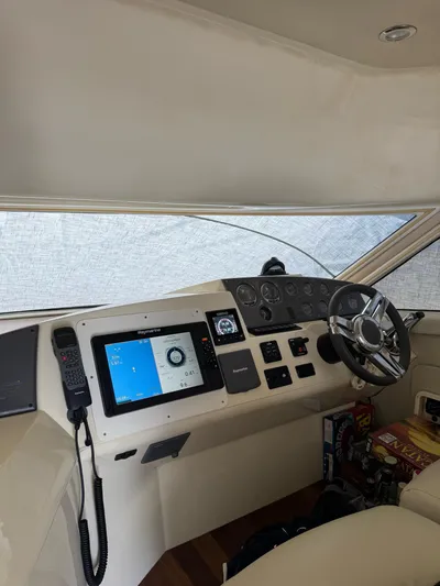  Yacht Photos Pics 2009 Sealine F42/5 yacht helm with modern navigation equipment and steering wheel.