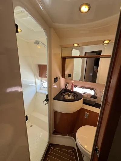  Yacht Photos Pics 2009 Sealine F42/5 yacht bathroom with modern fixtures and wood accents.