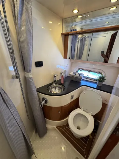  Yacht Photos Pics Luxurious bathroom in 2009 Sealine F42/5 yacht with modern fixtures and elegant design.