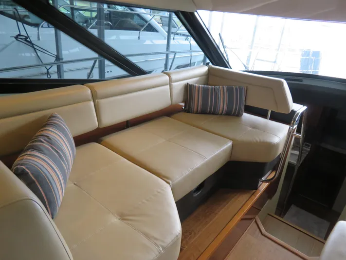 Sea-f-o Yacht Photos Pics Luxurious interior seating of 2015 Sea Ray 470 Sundancer yacht with striped cushions.