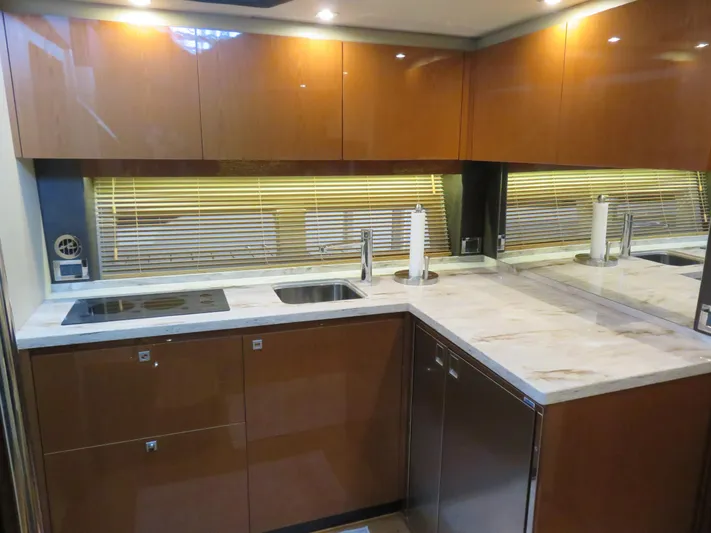 Sea-f-o Yacht Photos Pics Luxurious kitchen interior of 2015 Sea Ray 470 Sundancer yacht with modern amenities.