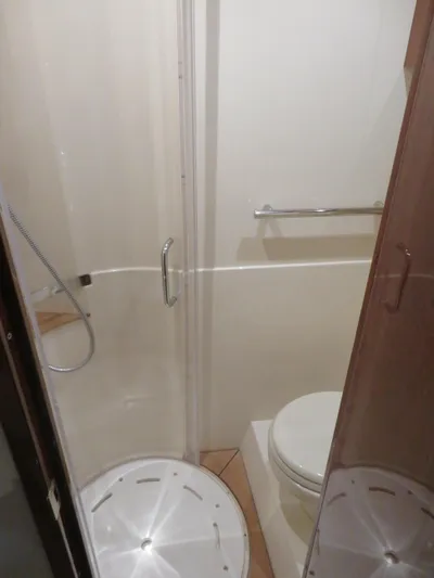 Sea-f-o Yacht Photos Pics Bathroom interior of 2015 Sea Ray 470 Sundancer yacht with shower and toilet.