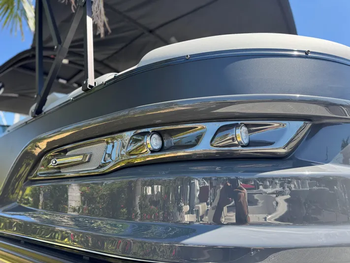  Yacht Photos Pics 2025 Avalon Excalibur 27' boat close-up, showcasing sleek design and modern detailing.