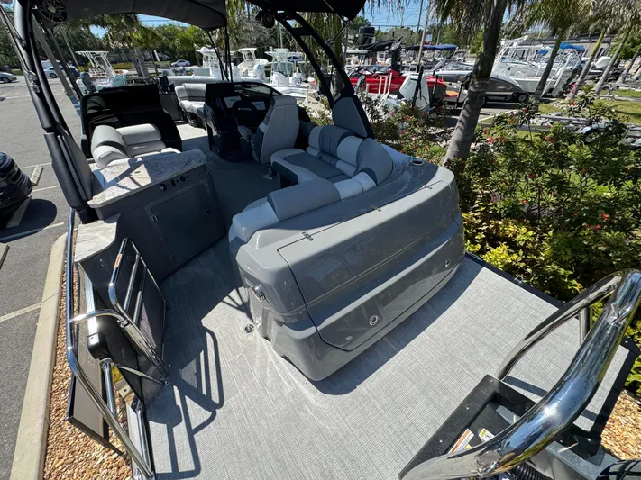  Yacht Photos Pics 2025 Avalon Excalibur 27' boat interior with sleek seating and modern design.