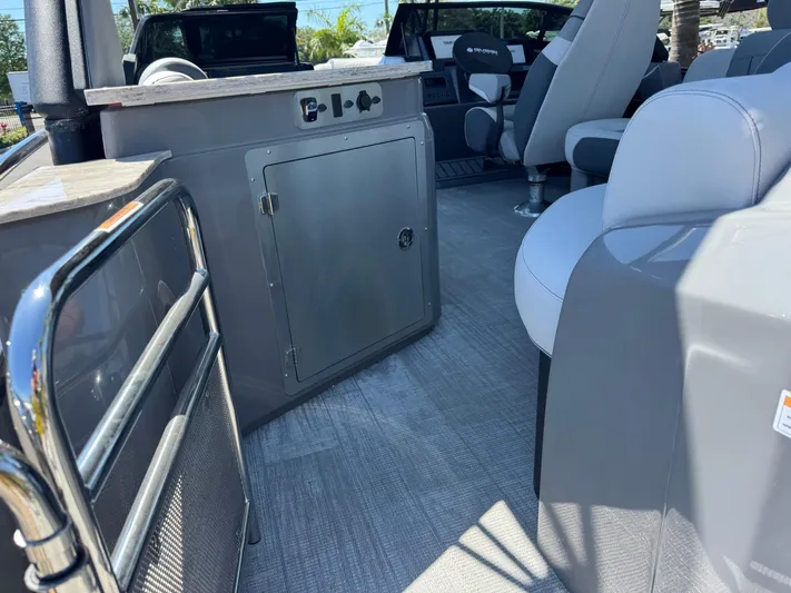  Yacht Photos Pics Interior of 2025 Avalon Excalibur 27' boat, featuring modern seating and sleek design elements.