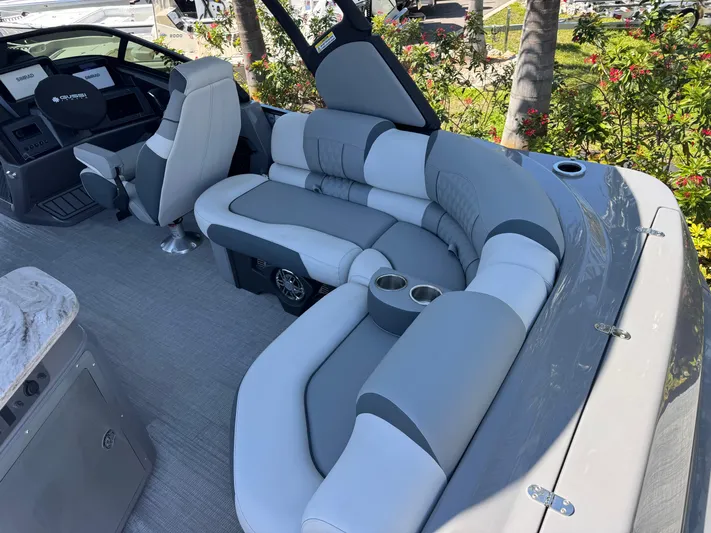  Yacht Photos Pics Luxurious seating on 2025 Avalon Excalibur 27' boat with modern design and cup holders.