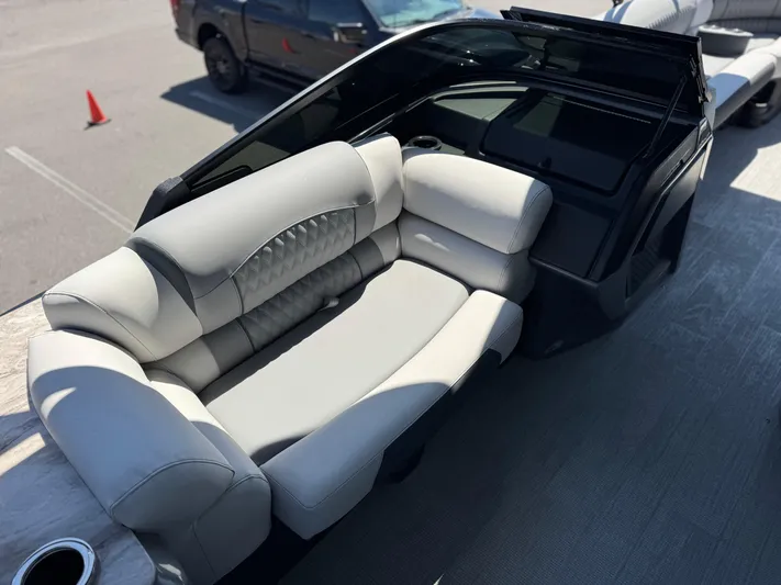  Yacht Photos Pics Luxurious seating on 2025 Avalon Excalibur 27' boat, featuring sleek design and comfort.