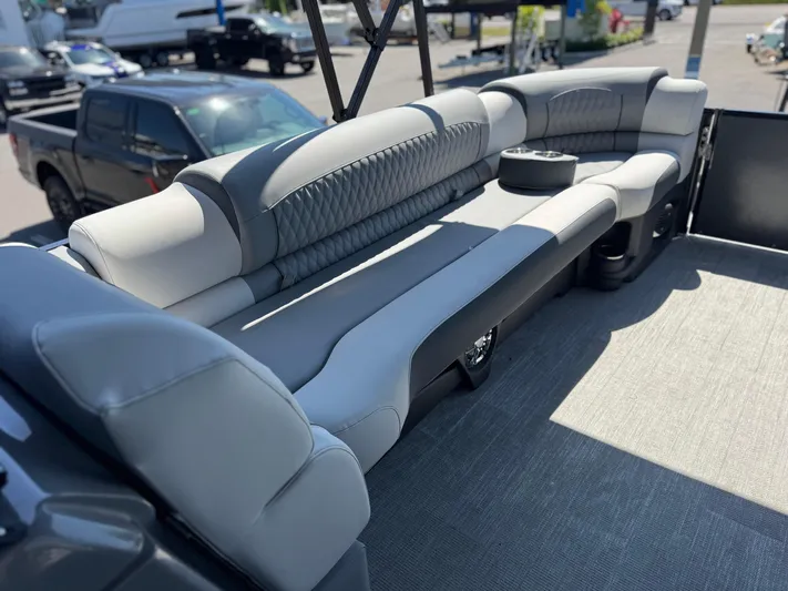  Yacht Photos Pics Luxurious seating on 2025 Avalon Excalibur 27' boat, featuring sleek gray upholstery.