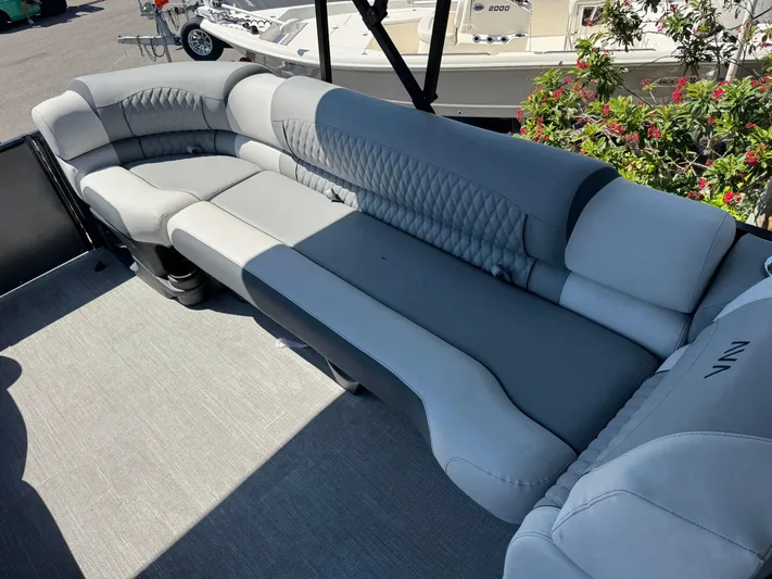  Yacht Photos Pics Luxurious seating on 2025 Avalon Excalibur 27' boat, featuring elegant gray upholstery.