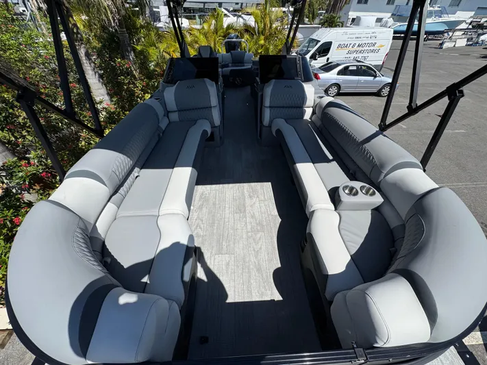  Yacht Photos Pics 2025 Avalon Excalibur 27' boat interior with luxurious gray seating and spacious layout.