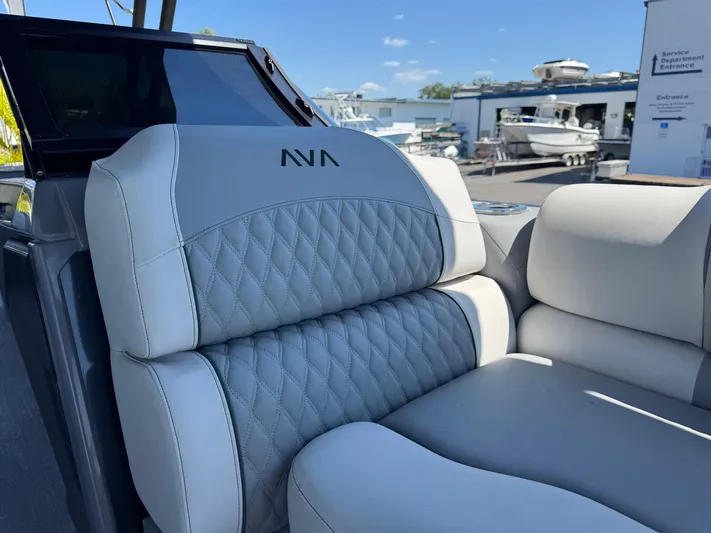  Yacht Photos Pics Luxurious seating on 2025 Avalon Excalibur 27' boat, featuring quilted upholstery.